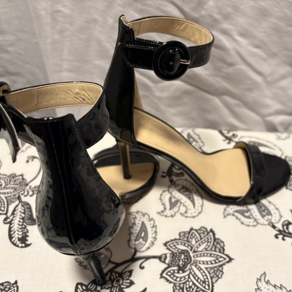 Patent Leather Black Ankle strap- heel Features open - toe design with a  single